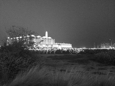 Exterior of the State Grand Mosque at night. Ramadan in Qatar – it's an interesting time to be living in or visiting Qatar, especially as a non-Muslim. Learn do's and don'ts for living in or visiting Doha during Ramadan.