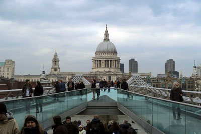 Hoards of people wander across the Millennium Bridge. Discover how to not look like a tourist in London.