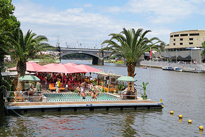 People chilling at Arbory Afloat, one of Melbourne's floating bars, one of the best things to do in Melbourne in summer.