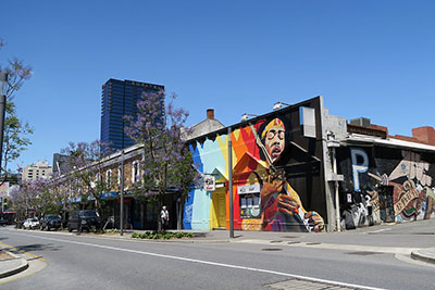 Street art featuring a portrait of Jimi Hendrix on Hindley Street. Discover how to spend 3 days in Adelaide.