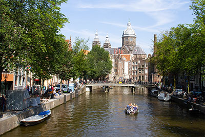 Summertime in Amsterdam, gazing up the canals. Discover how to spend two days in Amsterday with this 2 day Amsterdam itinerary.